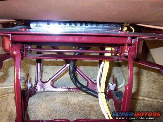 close-up of a car seat's metal frame and wiring