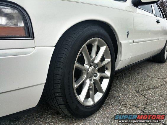 White 2000 Mercury Grand Marquis 3q-front view showing alloy wheel and fender