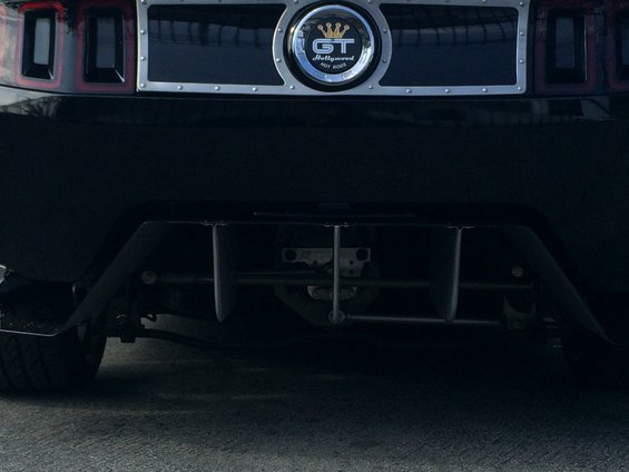 Rear view of a black car with a GT badge that says 'Hollywood Hot Rods'