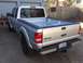 2010 Ford Ranger - Rear view of a silver Ford Ranger pickup truck parked in a driveway.