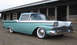 1959 Ford Ranchero - This 1959 Ford Ranchero is seen from a three-quarter front angle, parked in front of a rustic wooden structure.