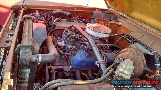 engine bay with blue valve covers and air filter