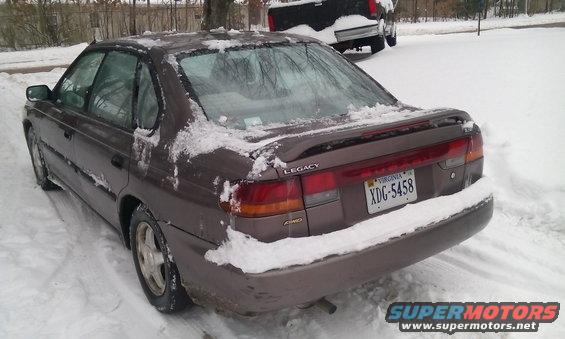 1996 Subaru Legacy sedan rear view in snow