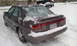 1996 Subaru Legacy - A 1996 Subaru Legacy sedan is seen parked in the snow.