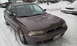 1996 Subaru Legacy - This 1996 Subaru Legacy sedan is parked outside in a snowy environment.