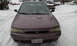 1996 Subaru Legacy - A 1996 Subaru Legacy is parked in the snow, with another vehicle visible in the background.