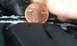 1996 Subaru Legacy - Tire tread depth is being measured using a penny.
