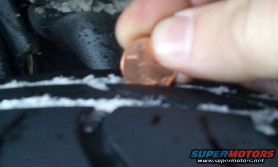 Tire tread depth test using a penny