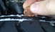 1996 Subaru Legacy - A penny is used to test the tread depth of a tire, indicating wear.