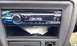 1996 Subaru Legacy - The interior of a car shows a Sony stereo with a blue illuminated display showing the word 'CONTROL'.
