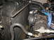 1979 Ford F-150 - The image shows the radiator, fan, and AC compressor in a vehicle's engine compartment.