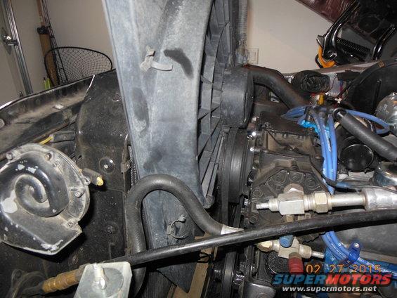 Engine bay view showing fan, horn, and engine components