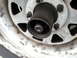 1981 Ford Bronco - Close-up of a vehicle's wheel hub assembly, showing internal splines and a dirty steel wheel.
