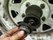 1981 Ford Bronco - A manual locking hub assembly is shown being removed from a vehicle's wheel hub.