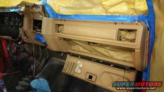 1983 Ford Bronco dashboard during restoration, showing exposed wiring and taped-off areas