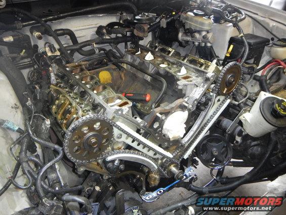 engine timing chain and gears exposed during repair