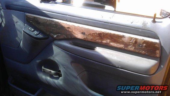 Interior door panel with wood trim and power window controls