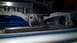 1993 Mercury Tracer - Close-up view of an engine bay a blue valve cover, intercooler, and radiator components.