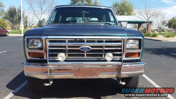 Dark blue 1980 Ford Bronco front view with chrome bumper and grille