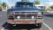1982 Ford Bronco - Front view of a dark blue Ford Bronco with a chrome bumper and grille.