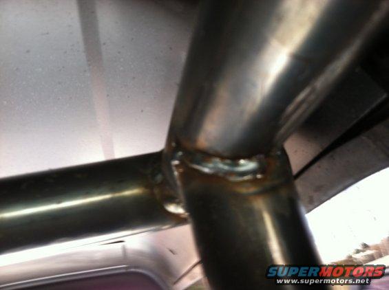 Close-up of welded roll cage tubing inside a vehicle