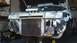 1993 Mercury Tracer - Front view of a 1993 Mercury Tracer undergoing repairs, with the hood raised to reveal engine components and the radiator.