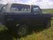 1979 Ford Bronco - This Bronco has a two-tone paint scheme and a prominent 4x4 decal on the rear quarter panel.