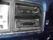 1979 Ford Bronco - Close-up of a car's dashboard, focusing on the aftermarket stereo and original climate controls.