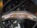 1979 Ford Bronco - The interior of a 1979 Ford Bronco shows wood grain trim on the dashboard and the Ford emblem.