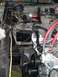 1979 Ford Bronco - Close-up view of the engine bay, showing various electrical wires and mechanical parts.
