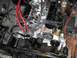 1979 Ford Bronco - Close-up view of a V8 engine bay, showing various components and wiring.