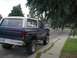 1979 Ford Bronco - This lifted Ford Bronco, likely a 1978 model, is parked on a suburban street, partially obscured by tree branches.