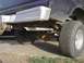 1979 Ford Bronco - Rear view of a 1979 Ford Bronco, showing the bumper, exhaust, and tire.