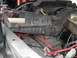 1979 Ford Bronco - The engine bay shows a battery, air filter housing, and various hoses and wiring.