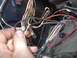 1979 Ford Bronco - A complex web of wires, likely from a vehicle's dashboard or engine bay, is being examined.