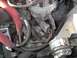 1979 Ford Bronco - Engine bay detail showing the distributor cap, spark plug wires, and coolant hoses.