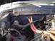 1979 Ford Bronco - The engine bay shows a complex network of wires and red hoses, with a watermark indicating the source of the image.