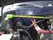 1979 Ford Bronco - A measuring tape is used to assess dimensions within the engine bay of a vehicle.