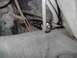 1979 Ford Bronco - Close-up view of the undercarriage, showing various hoses and metal parts, with a Supermotors.net watermark visible.