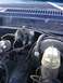 1979 Ford Bronco - Engine bay components, including brake booster and vacuum lines, are shown in this close-up view.