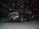 1979 Ford Bronco - A black 1979 Ford Bronco sits in the snow during a winter night.