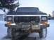 1979 Ford Bronco - This Ford truck, likely from the late 1970s, is equipped with a heavy-duty winch bumper and winter tires.