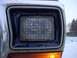 1979 Ford Bronco - Close-up of the headlight and amber turn signal on a 1979 Ford Bronco.