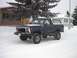 1979 Ford Bronco - A dark blue 1978 Ford Bronco sits in a snowy landscape, its lifted suspension and large tires ready for winter conditions.