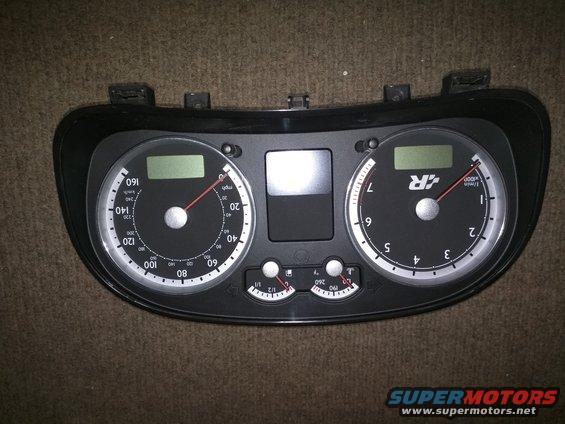 VW gauge cluster with speedometer and tachometer. Tachometer has 'R' logo