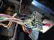 1993 Ford Bronco - Close-up of a vehicle's interior wiring harness, showing numerous colored wires and connectors.