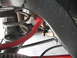 1972 Ford Ranchero - Undercarriage view shows suspension parts including a red sway bar and coil spring.