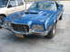 1972 Ford Ranchero - Front 3/4 view of a blue 1972 Ford Ranchero with a scoop on the hood.