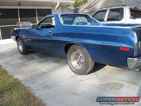 Blue 1972 Ford Ranchero, three-quarter front view, parked on concrete driveway