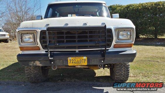 White 1978 Ford Bronco front view with a black grille guard and yellow Virginia license plate